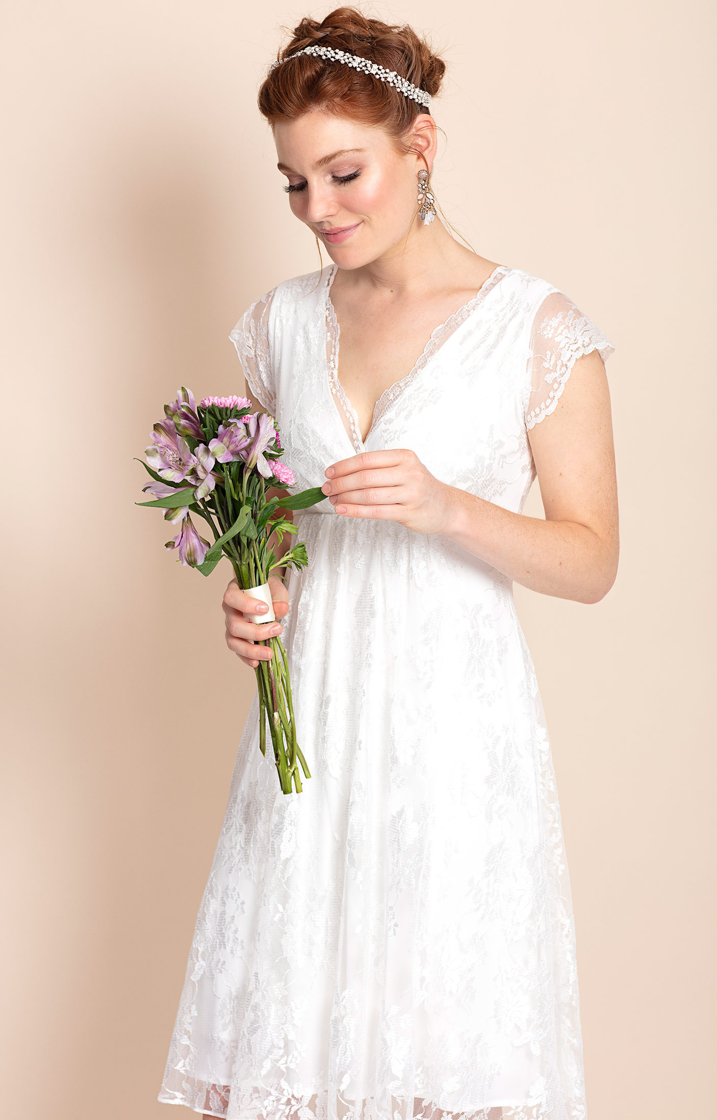 Delicate petite bride in simple minimalist wedding dress with large bow  sash Stock Photo | Adobe Stock